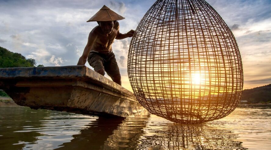 Fisherman fishing in Mekong River (096) Credit sirisakboakaew stock.adobe.com min