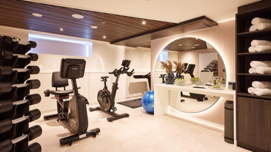 AMADEUS Riva Fitness Room Fitness Room in AMADEUS Riva with big mirror and minimalistic details Lueftner Cruises Amadeus Tom Yasny